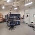 A clean lab with medical equipment and chairs.