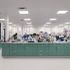 A clean, well-organized laboratory with green cabinets and scientific equipment.